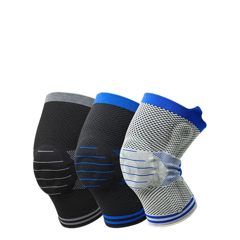Black and gray knee pad with silicone shock absorber for sports protection on a leg.
