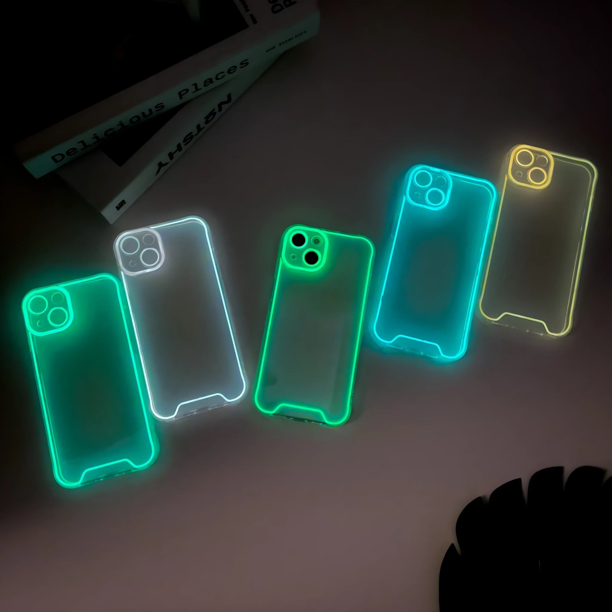 Glow in the dark Christmas themed soft TPU phone case for Apple iPhone, shown in multiple colours.