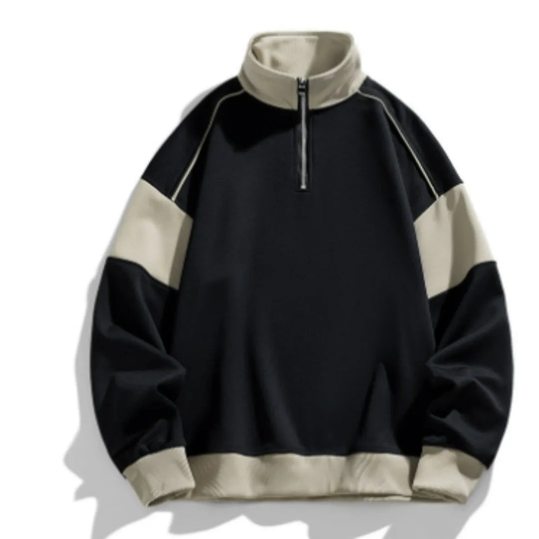 Man wearing a thin black hooded corduroy sweatshirt with drop shoulder and loose lapels.