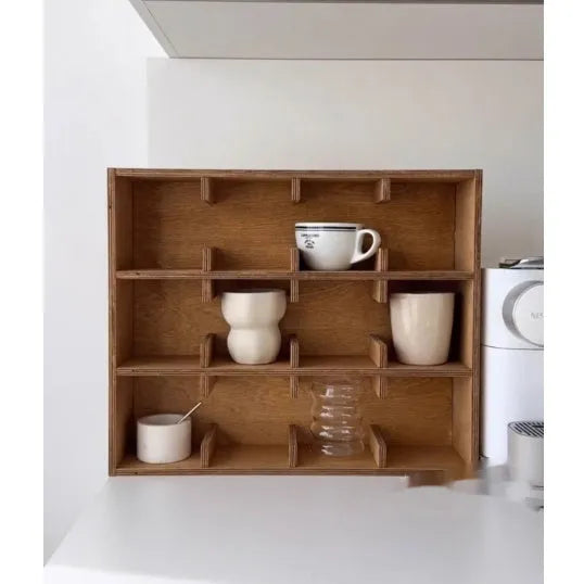 Square solid wood storage rack with multiple grid compartments for cups and mugs in a birch wood finish.