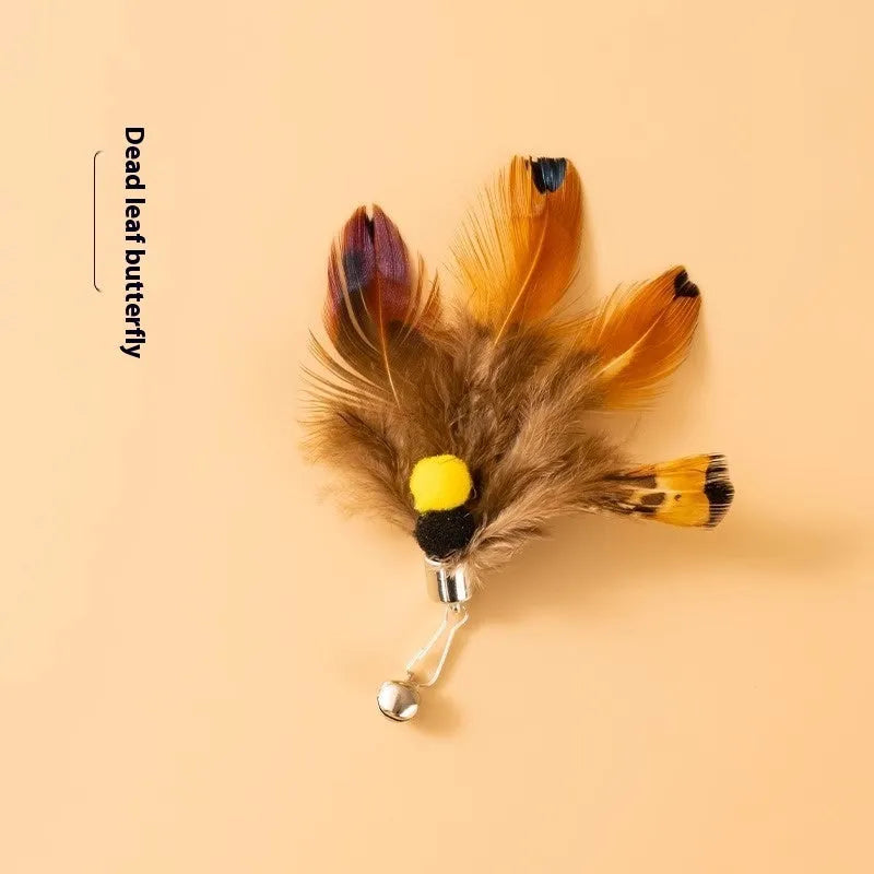 Three steel wire cat toy replacement heads shaped like small flying insects in assorted colours.