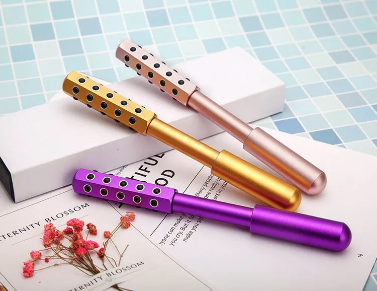Germanium particles roller beauty massage instrument measuring 193mm long in purple colour