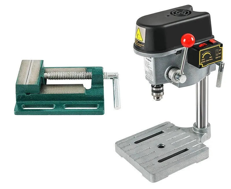 Bench-mounted drilling and milling machine with motor, chuck, and adjustable work table.