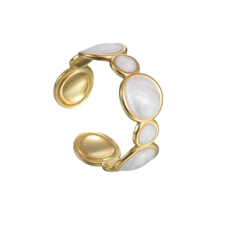 A geometric stainless steel ring with an adjustable opening and an electroplated finish.