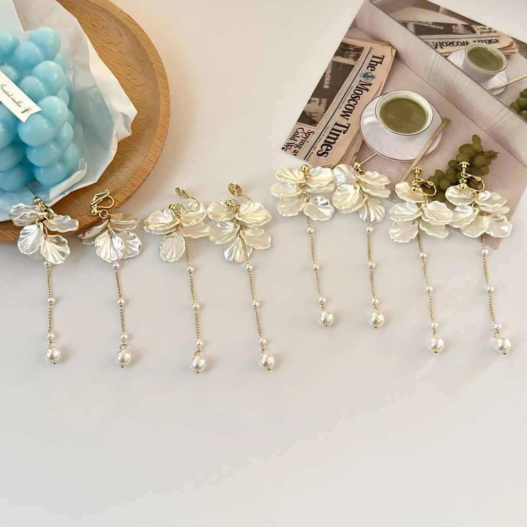 Women's acrylic shell pearl tassel earrings showing 8.8cm length and clip attachment options