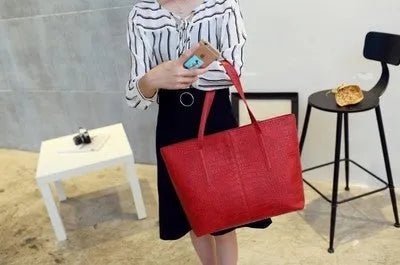 Simple fashion shoulder handbag in black and grey colours with adjustable strap