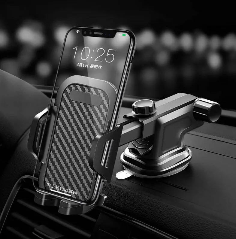 Black universal car phone holder mounted on a car dashboard holding a mobile phone