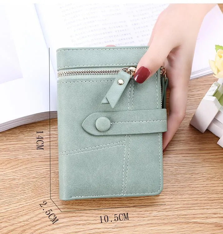 Vegan woman faux leather short wallet with zipper closure in solid colour, showing interior with bill and card compartments