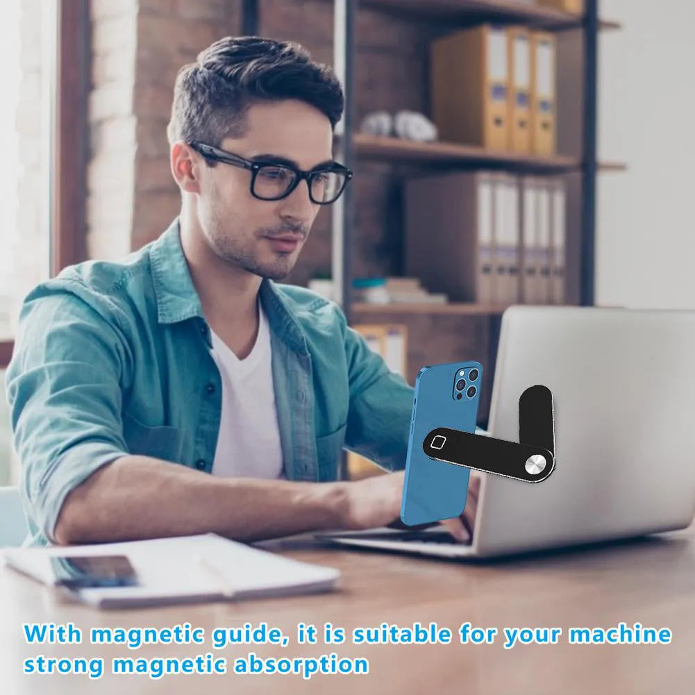 Black aluminium laptop phone holder with magnetic mount attached to computer monitor