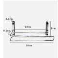 Silver stainless steel paper towel rack mounted on back of white cabinet door.