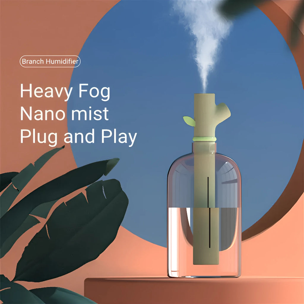 Transparent plastic USB portable humidifier with water tank showing mist output