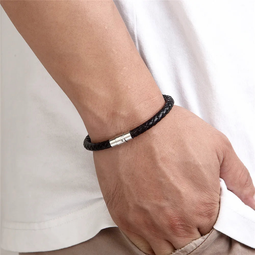 Geometric titanium steel wire bracelet with a magnetic clasp on a wrist, shown in a silver colour.