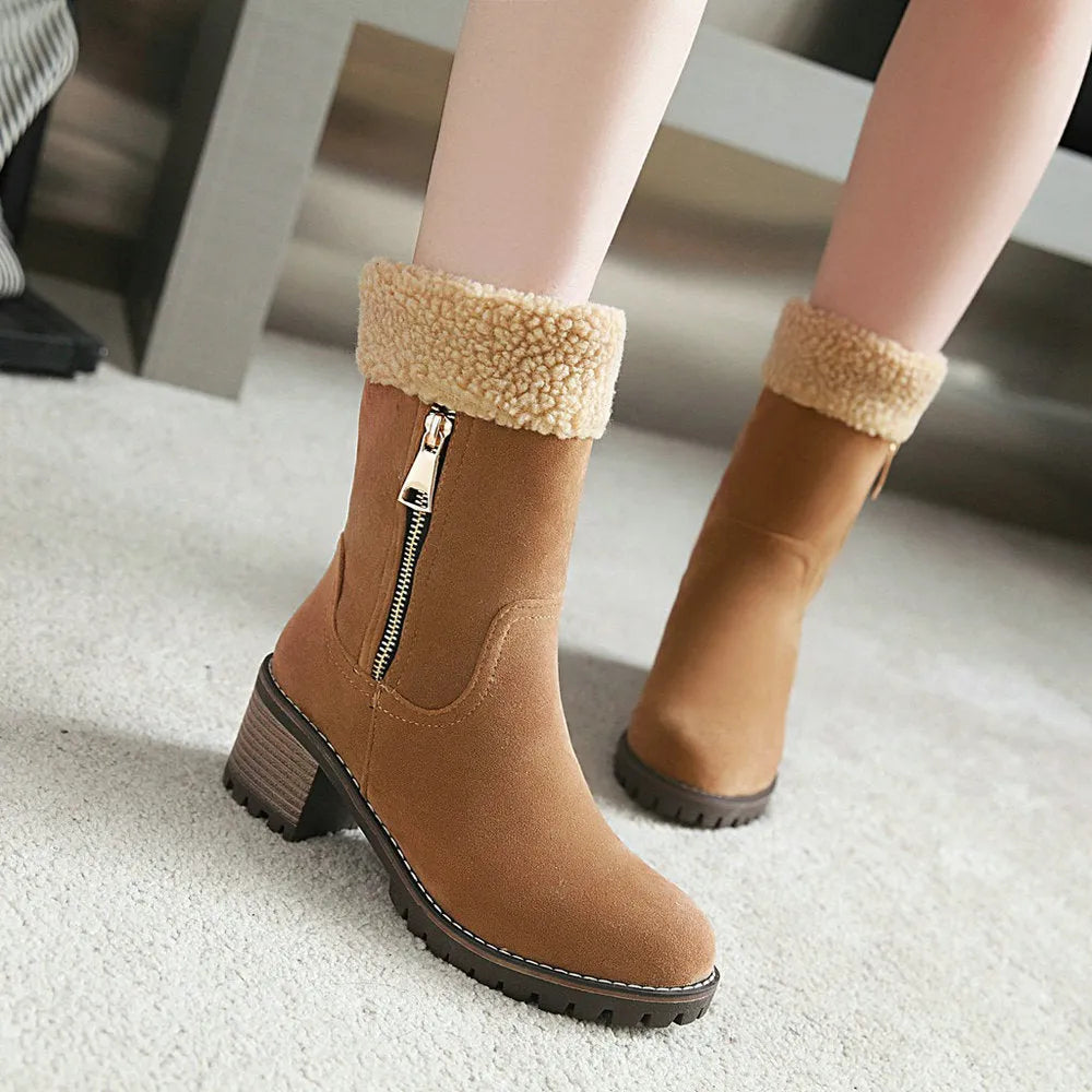 Snow boots with rubber sole and plush lining in black, grey, green, or orange colour options.