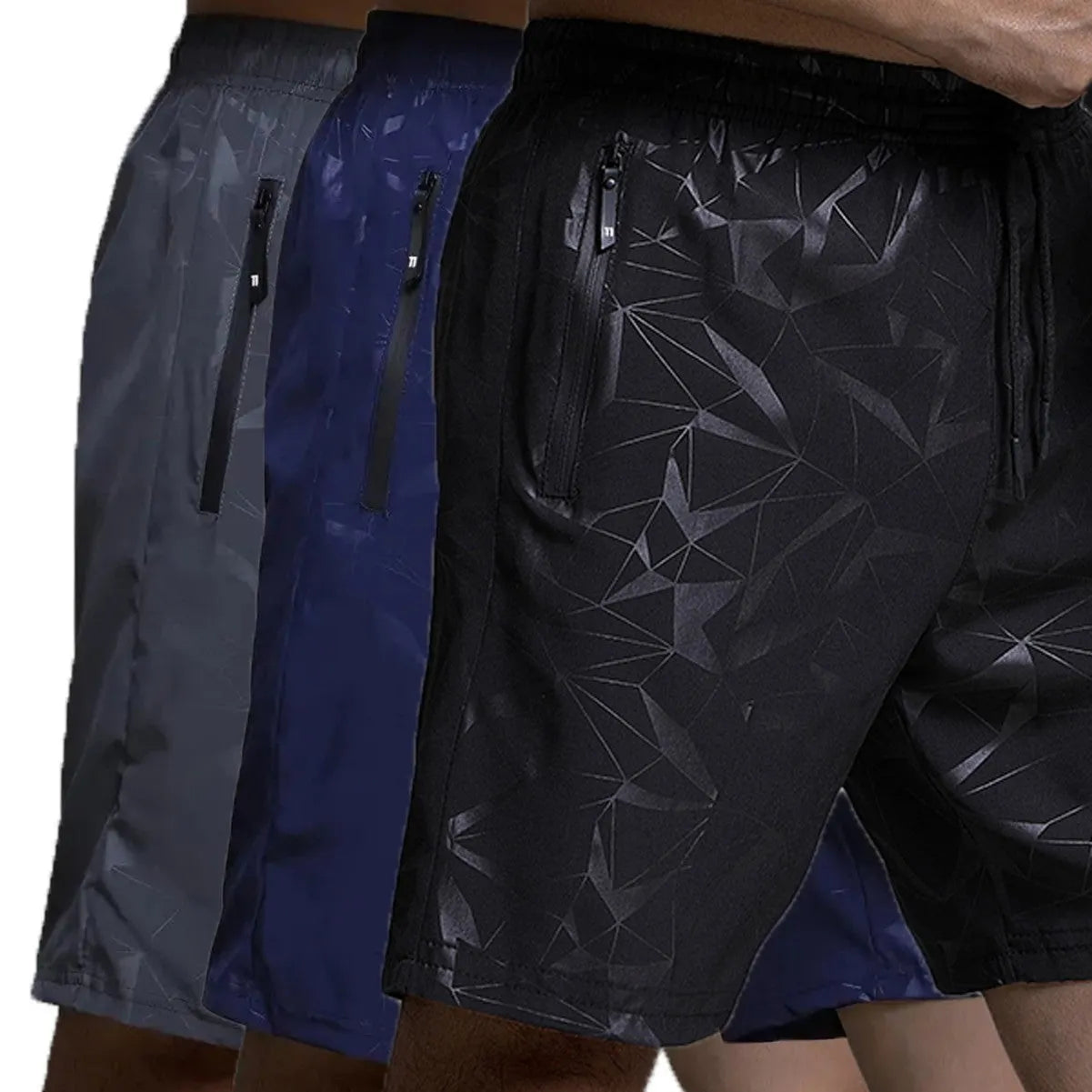 Man wearing loose fit grey polyester sports shorts with elastic waistband.