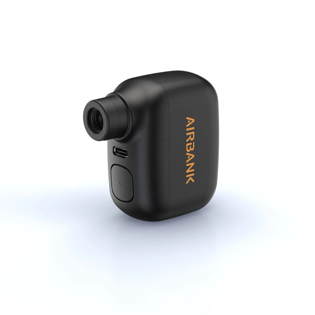 Black AS100 mini electric bike pump with USB charging cable and waterproof bag.