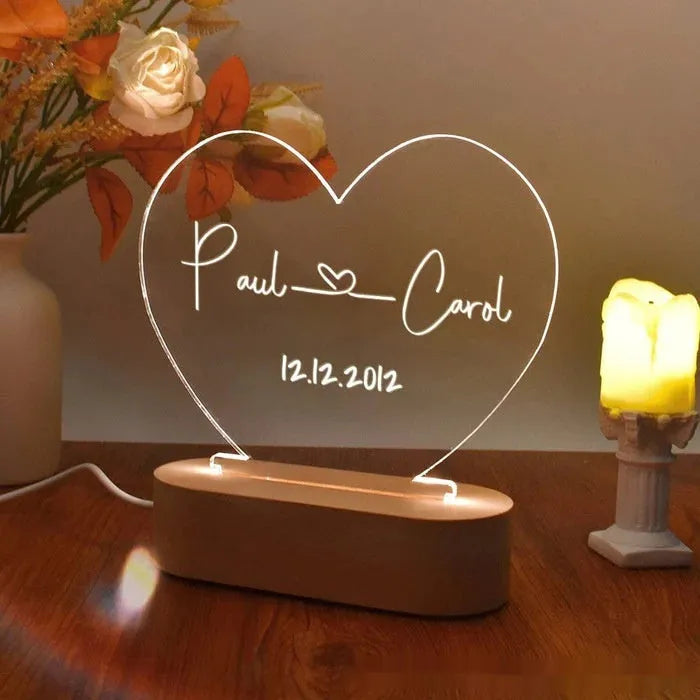 Personalised acrylic LED night light showing custom names and dates with transparent 20x11.5cm design