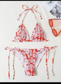 Women's floral pattern halter swimsuit briefs in light blue on a mannequin