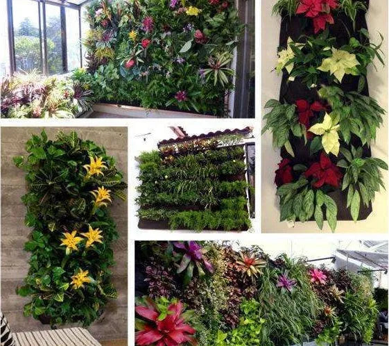 Green felt vertical wall garden planter bag with multiple planting pockets hung on a fence.