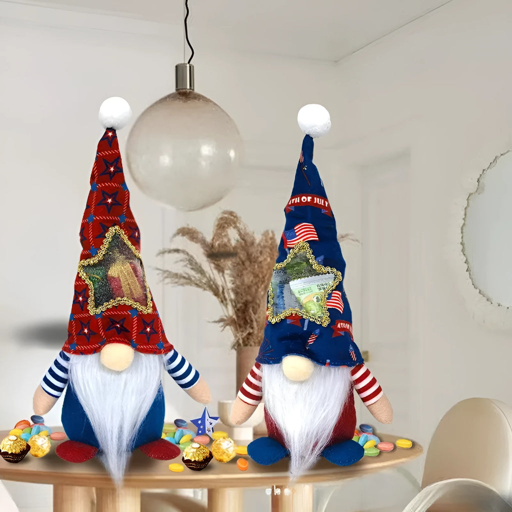 Two faceless baby doll Christmas ornaments dressed in red reindeer suits with white trim, made from cloth.