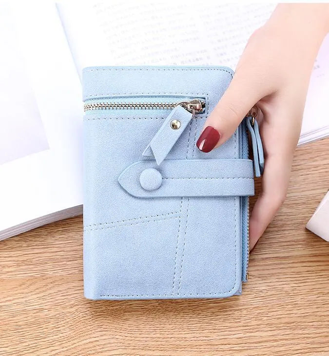 Vegan woman faux leather short wallet with zipper closure in solid colour, showing interior with bill and card compartments