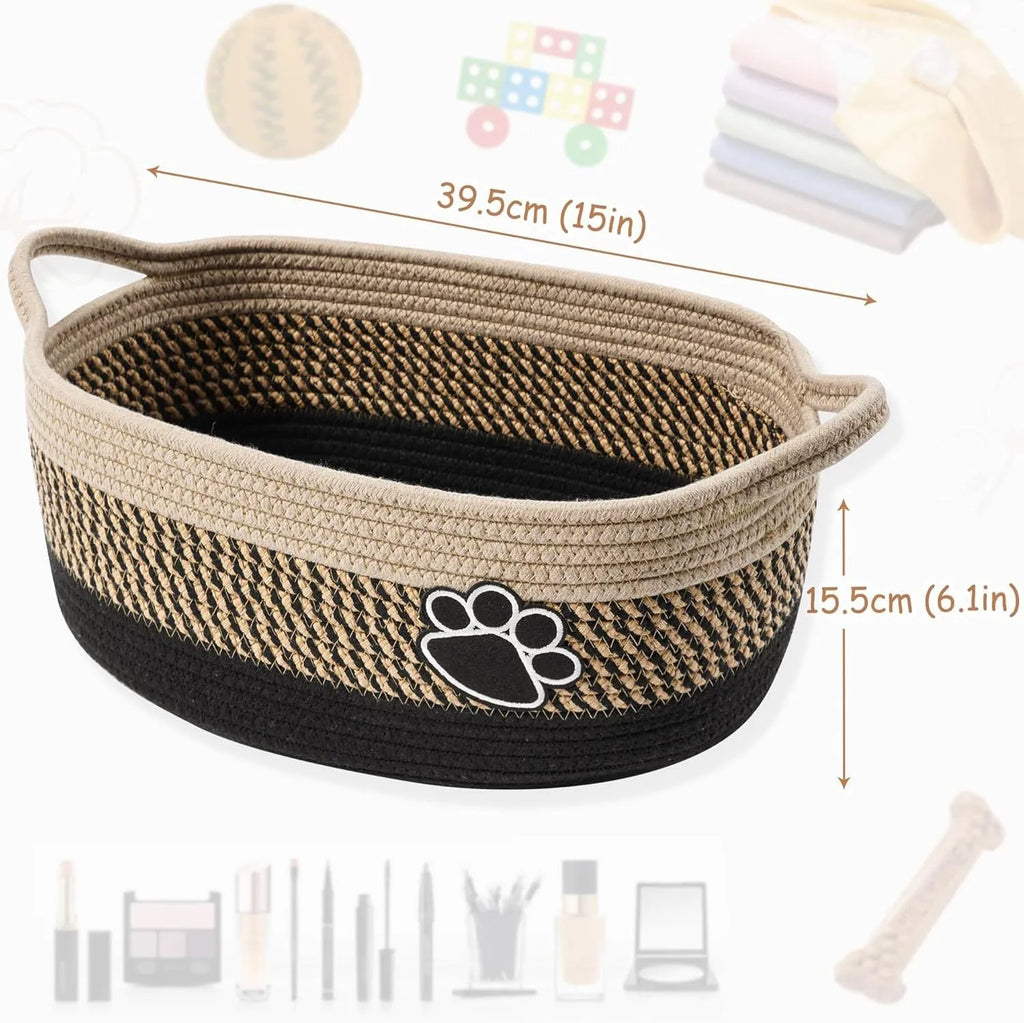 Handmade light beige woven cotton rope storage basket with a handle, shown on a wooden surface.