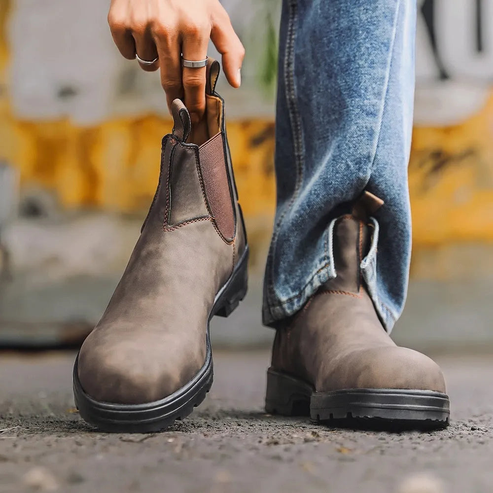 Vintage brown Chelsea boots with frosted PU upper and beef tendon sole on a neutral background