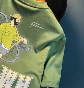 Green loose fit men's T-shirt with a printed literary youth graphic on the front.
