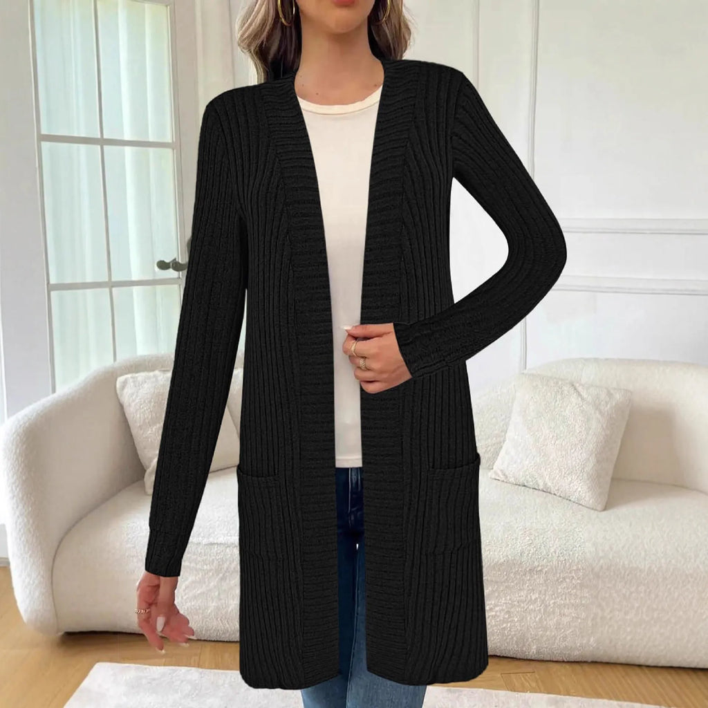 Loose fit grey knitted cardigan jacket with long sleeves and patch pockets on a hanger.
