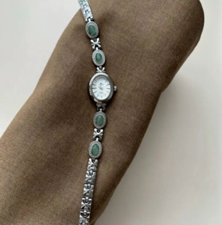 Green jade ladies quartz watch with silver case and white face