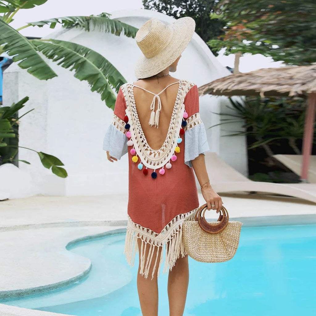 Orange floral pattern beach overskirt with hand crochet stitching and tassel detailing.