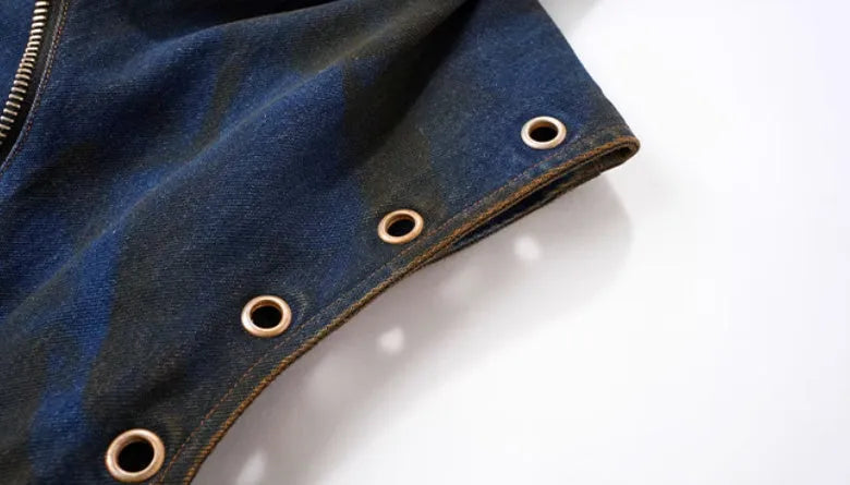 Blue heavy industry style hooded denim vest coat with matching trousers laid flat.