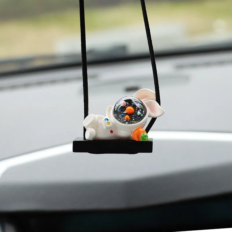 Resin astronaut car pendant with cartoon space explorer designs including telescope and radish variations