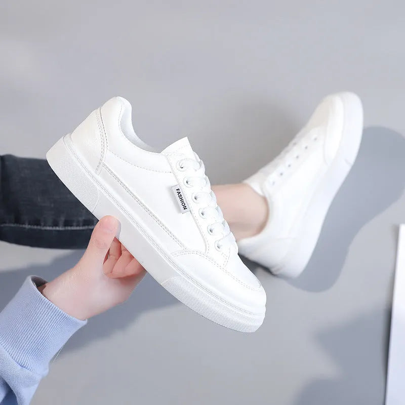 Korean style low-top sneakers in brown and white colours with artificial PU leather uppers
