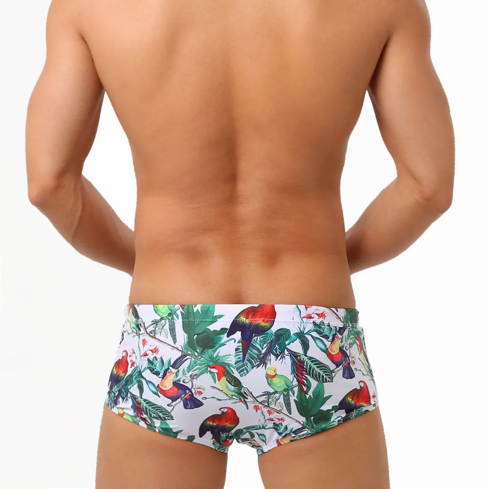 Men's floral and bird print swimming trunks in nylon fabric with elasticated waistband