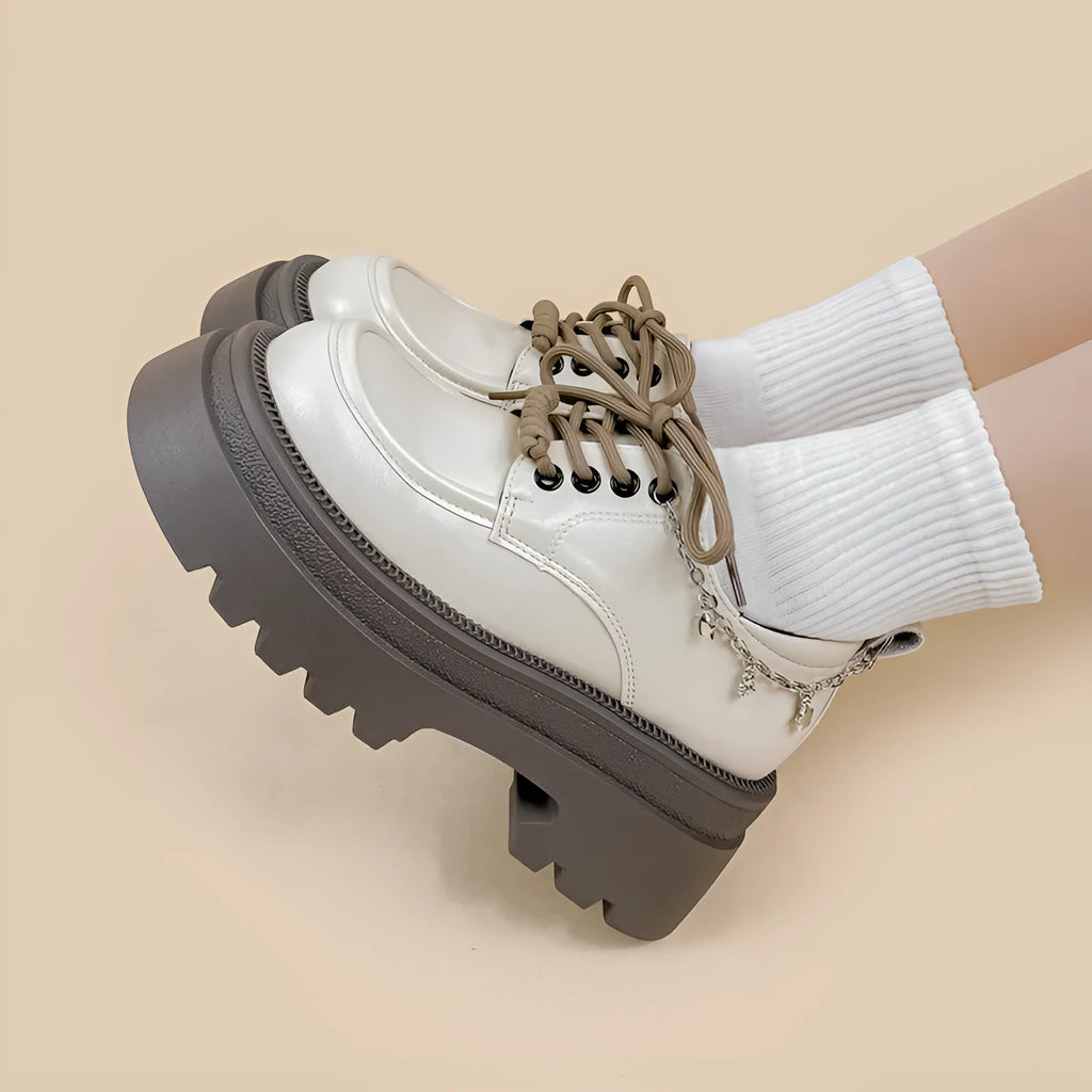 White women's platform Mary Jane shoes with round toe, chunky heel, and front lace-up in British college style.