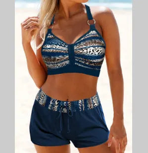 Women's navy blue and print two-piece polyester bikini swimsuit showing front design