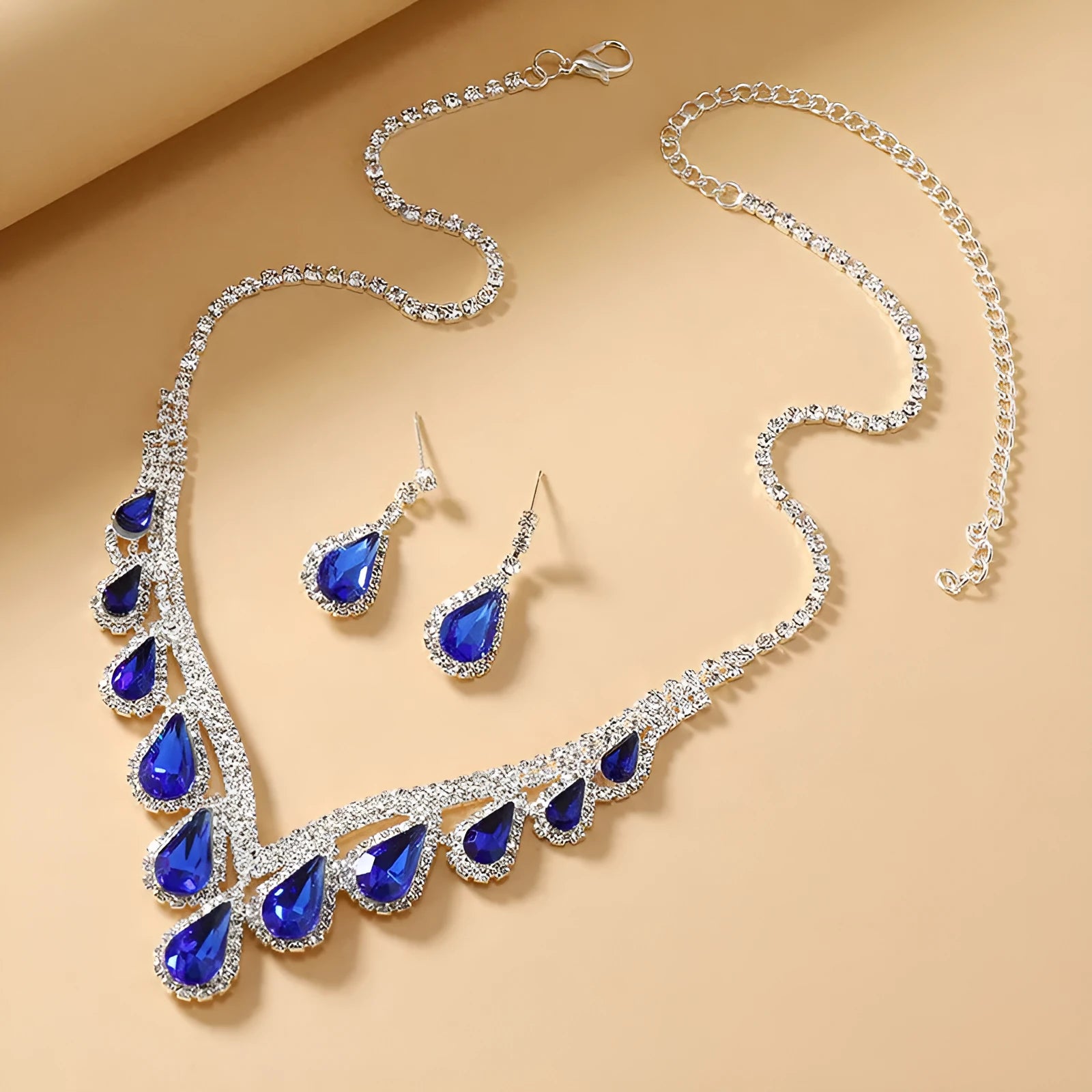 Royal Blue White K alloy jewellery set with a regular chain necklace and earrings on display