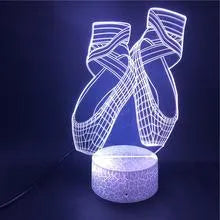 3D laser-etched ballet shoe night light with coloured LEDs on an ABS base, showing remote control.