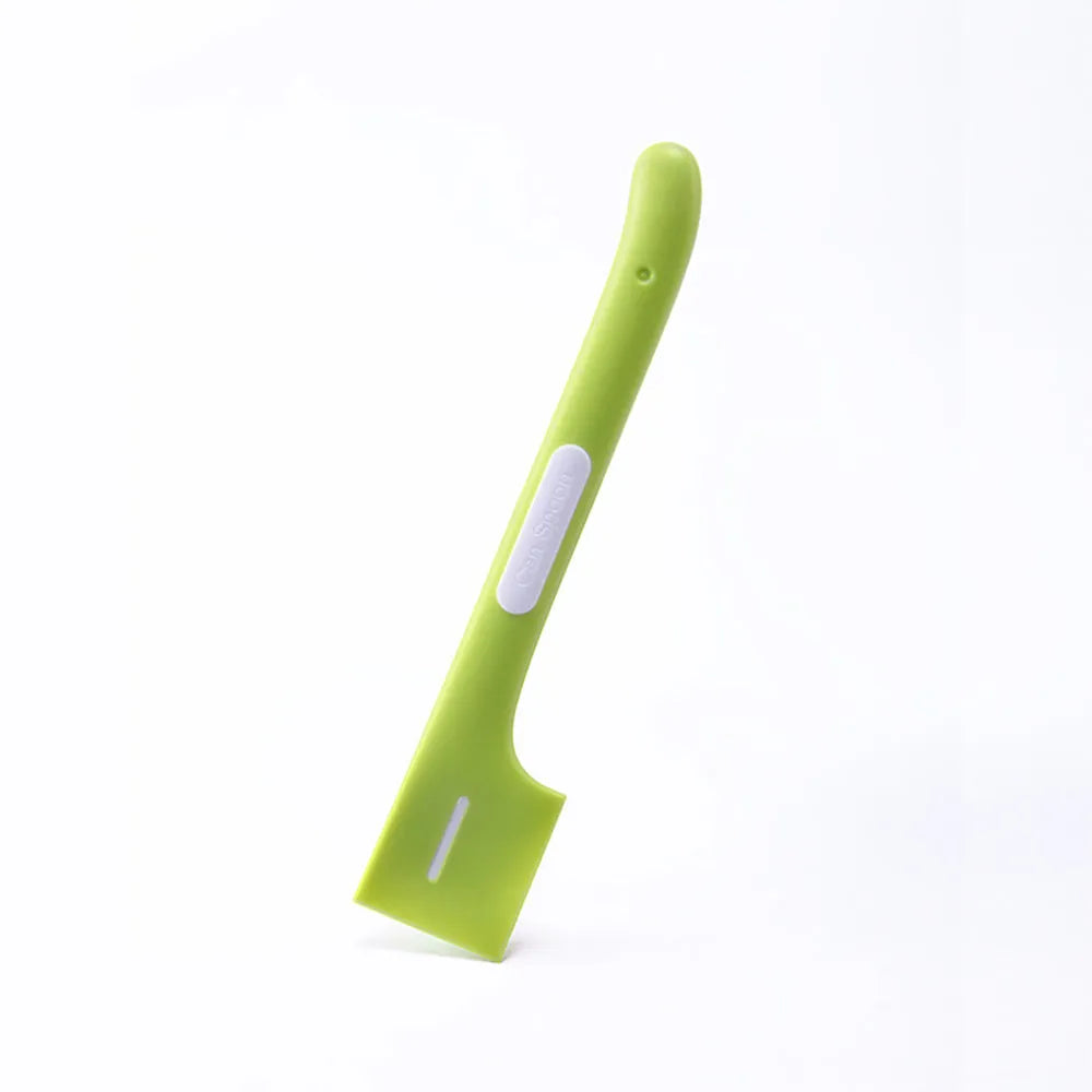 Green long-handled pet food spoon with right-angle head for scraping canned wet food.