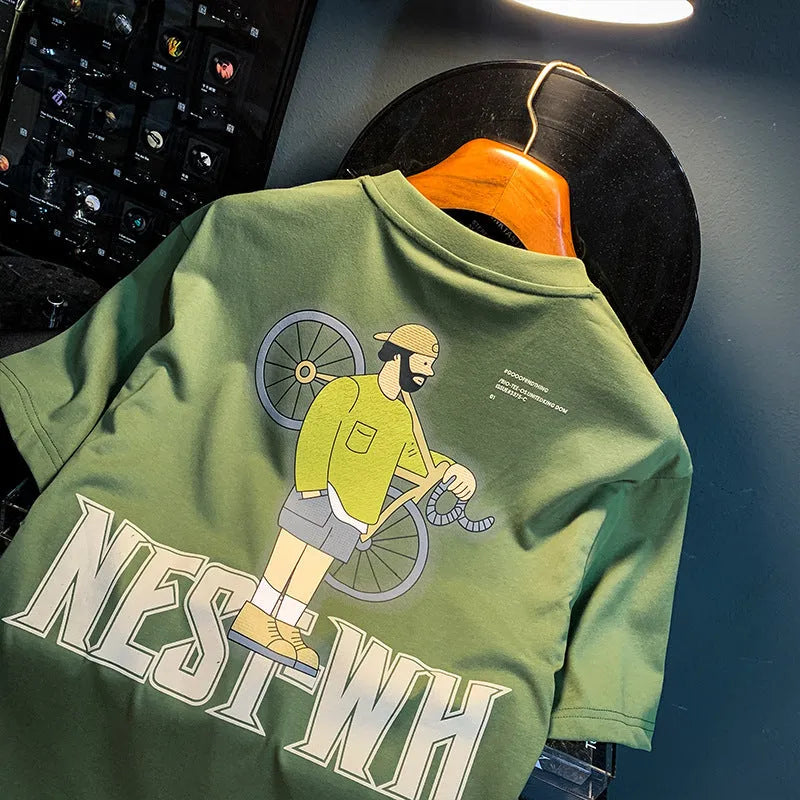 Green loose fit men's T-shirt with a printed literary youth graphic on the front.
