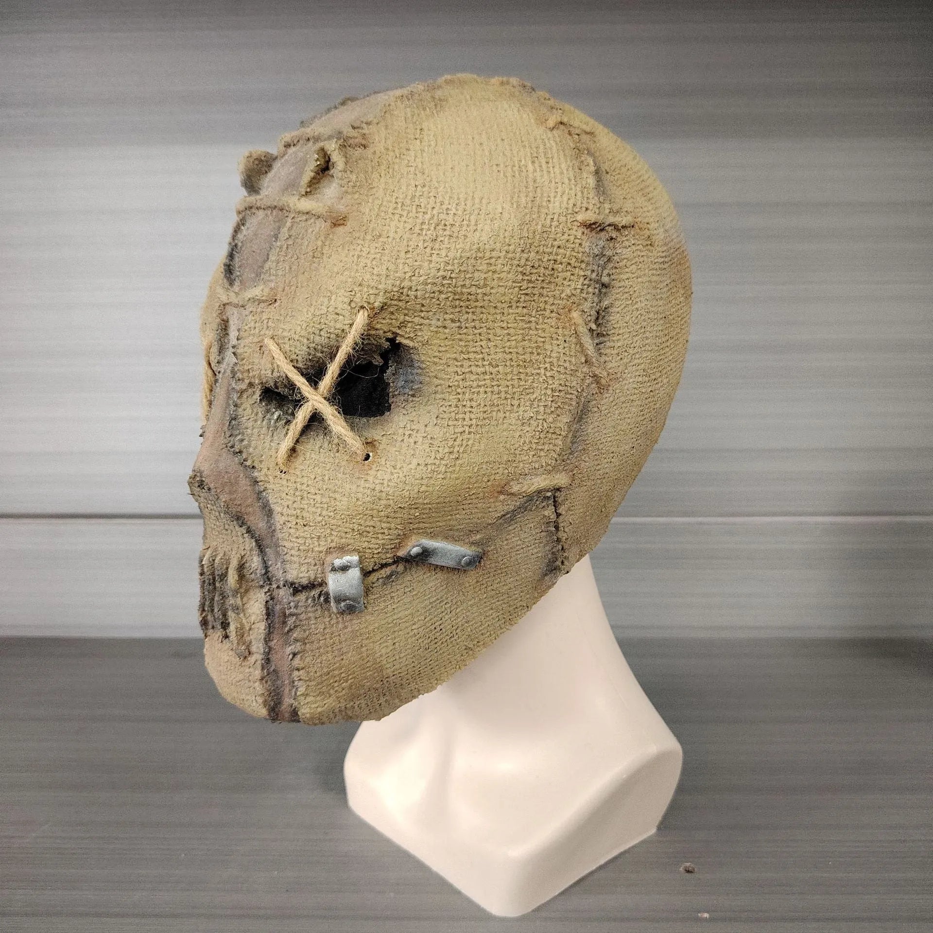 Latex Halloween horror mask with scar skull design, shown as a full head cover.