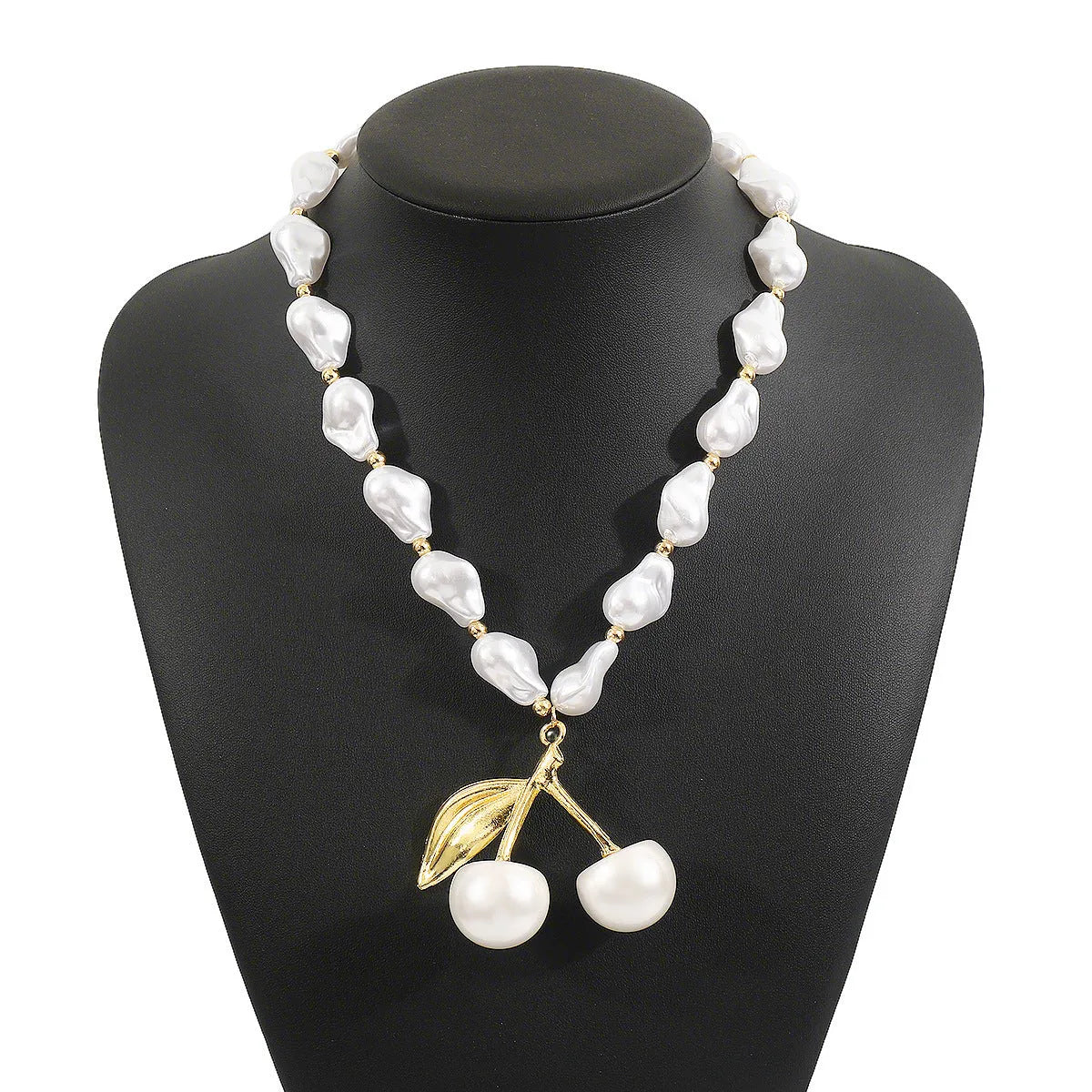Gold coloured alloy cherry fruit pendant on an adjustable imitation pearl necklace for women.