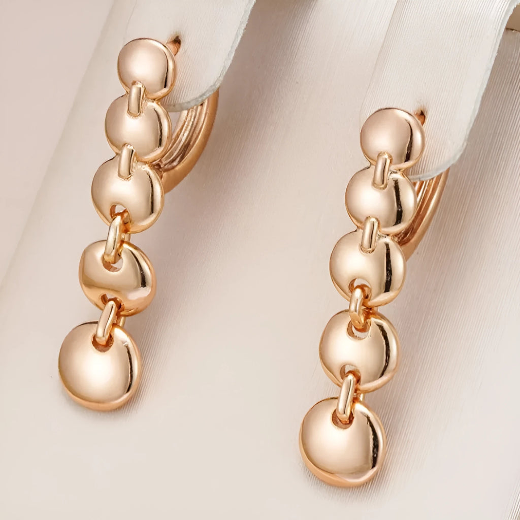 Gold-coloured retro circle earrings with 8cm diameter woven copper construction