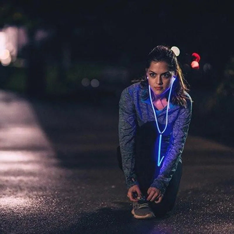 Blue light-up LED earphones with remote microphone and 3.5mm plug, compatible with iPhone.