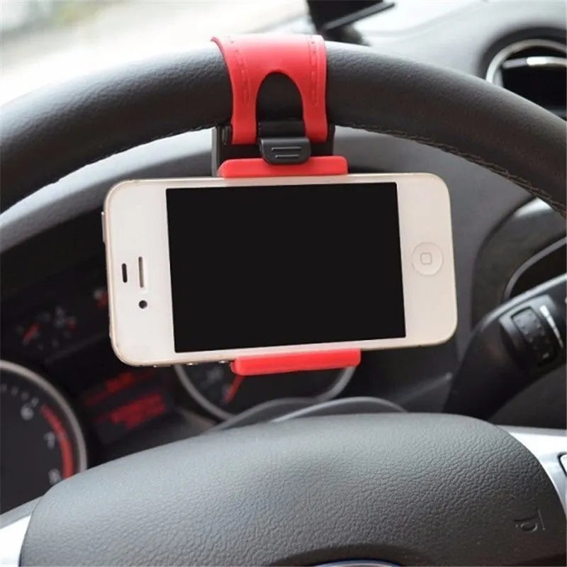 Black steering wheel phone clip holder mounted with smartphone showing navigation display