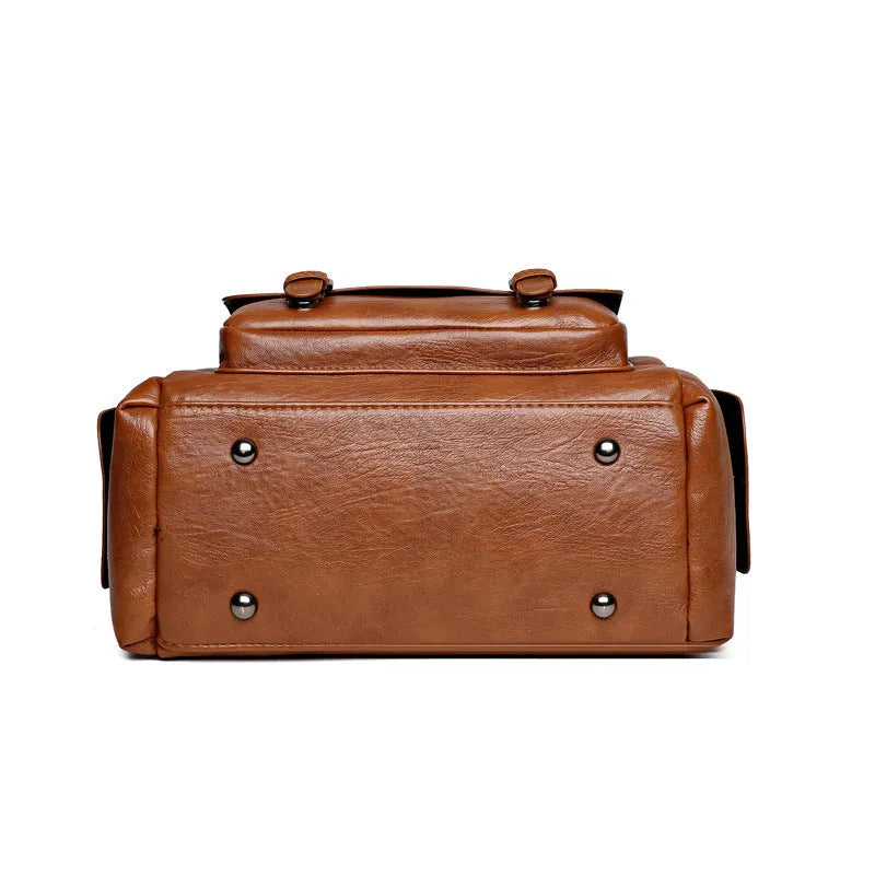 Large capacity vintage messenger bag in horizontal square shape, shown in available colours: blue, gray, camel, red, black, brown.