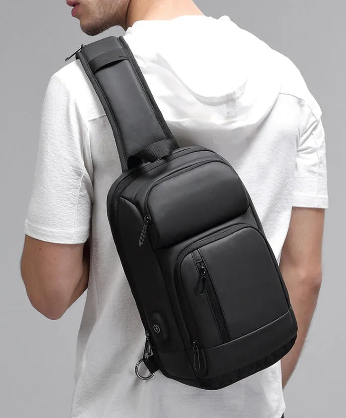 Black PVC outdoor leisure shoulder bag with air cushion strap and internal organisers