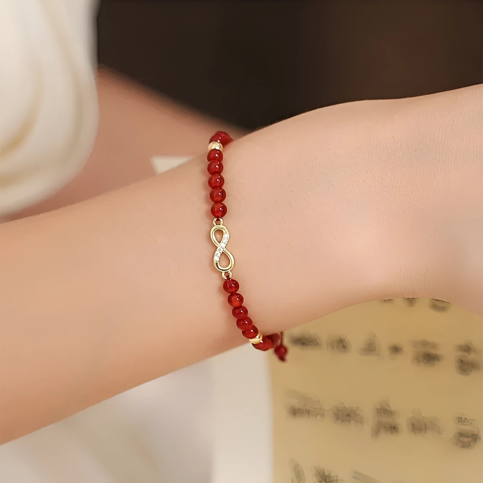 Hand-woven red agate bracelet with diamond beads in ethnic woven pattern
