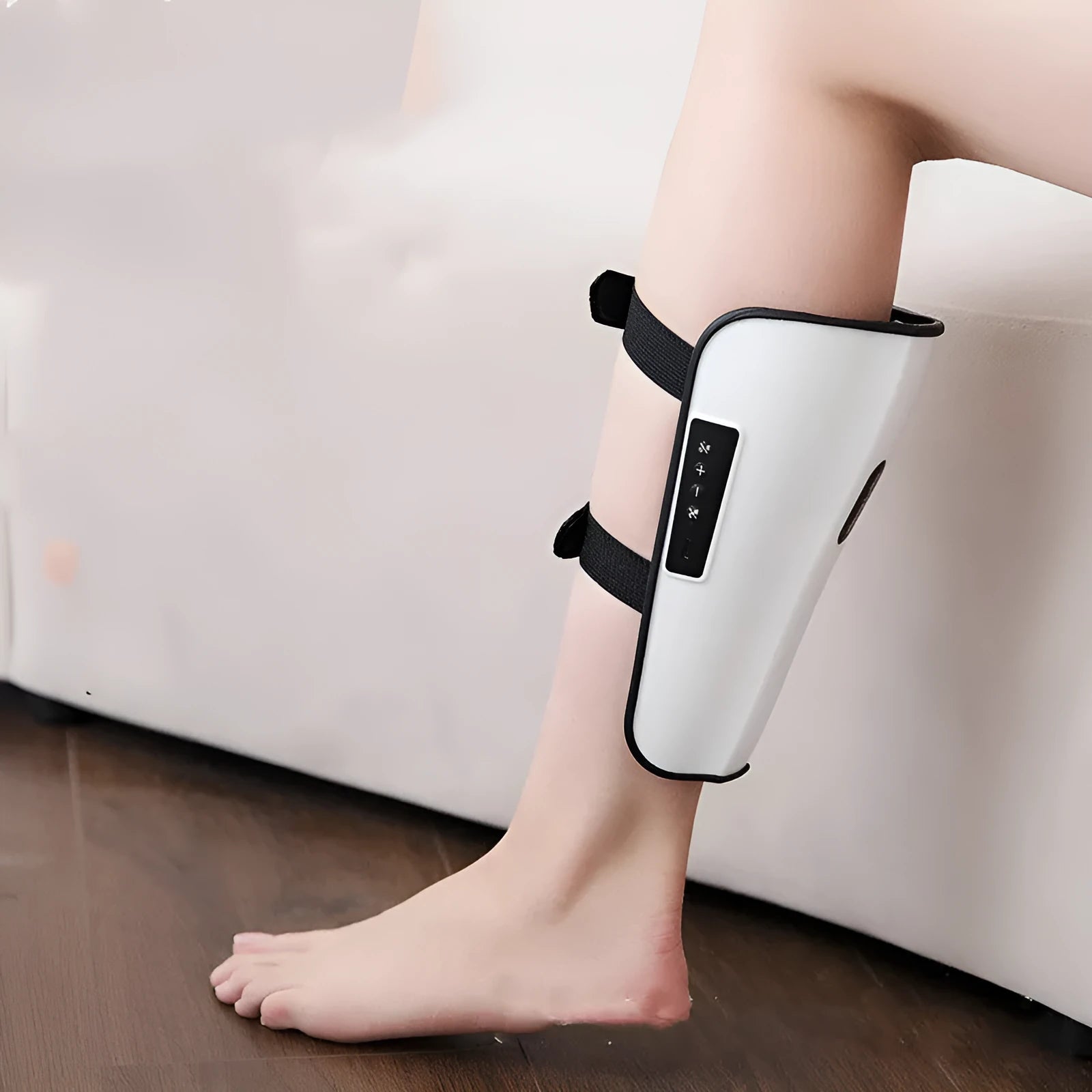 White plastic pulse calf massager with electrotherapy pulse technology and mechanical controls