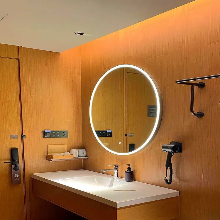 Round smart bathroom mirror with black aluminium frame and integrated LED lighting